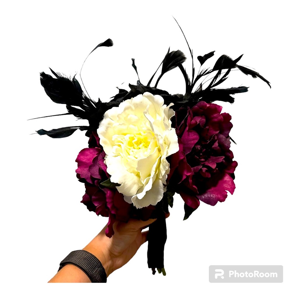 Stunning wedding bouquet with faux flowers and feather accents